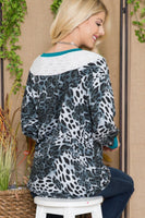 Celeste Full Size Animal Print Eyelet V-Neck Top
